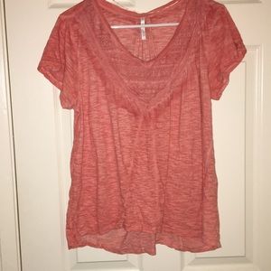 Pink shirt with textured design on the front